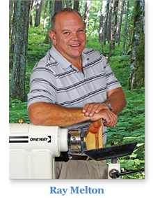 Ray standing behind his lathe